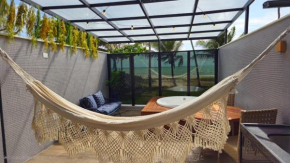 Studio com jacuzzi aquecida pé na areia vista mar!